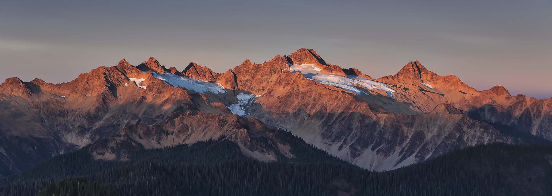 Twin Sisters, a red mountain range with snow pockets